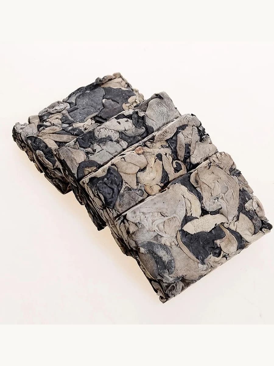 Compressed black fungus blocks showing pressed dried wood ear texture