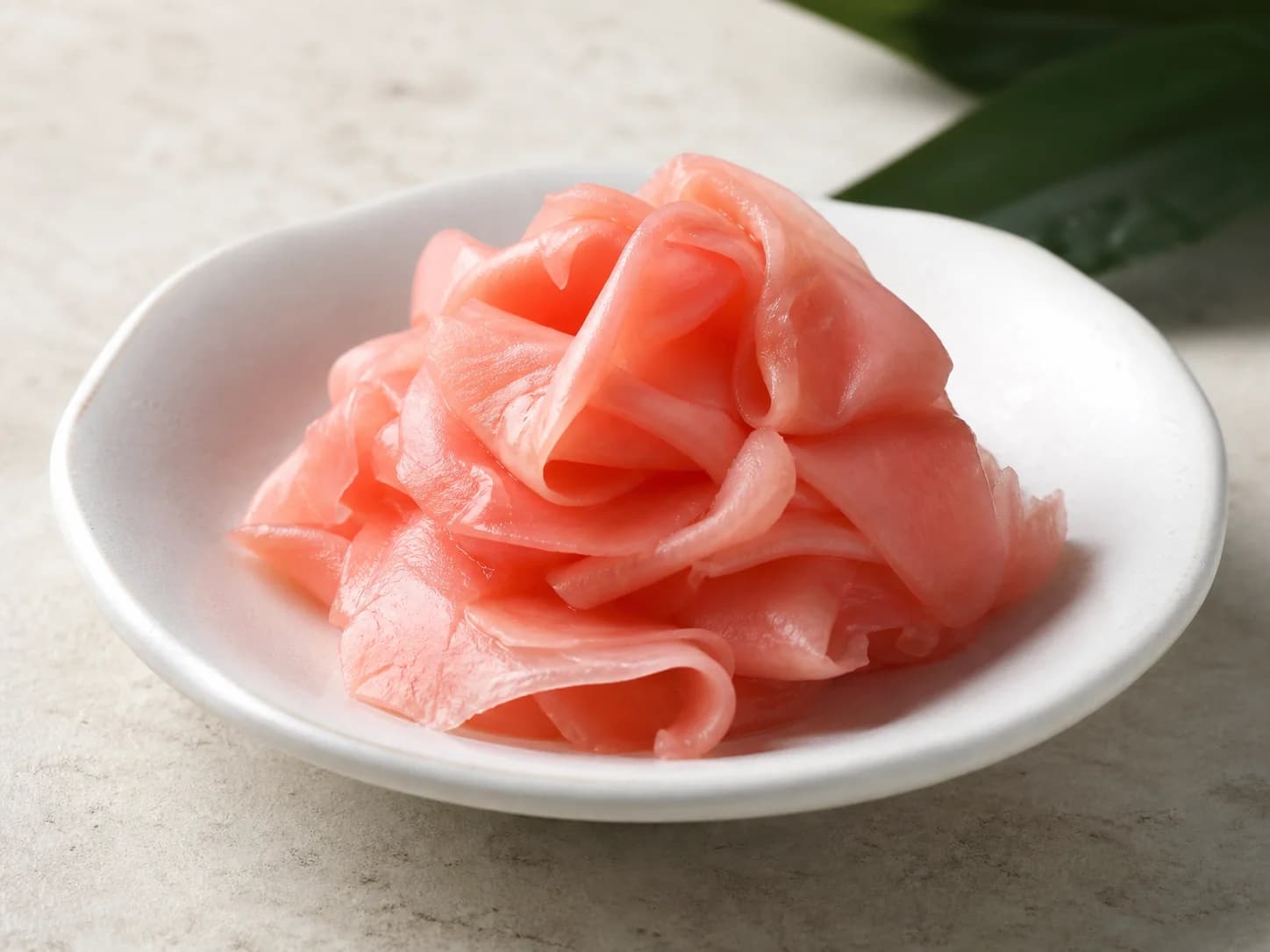 Thin sliced pink sushi ginger red gari prepared for procurement sample review